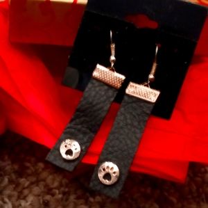 Dog paw leather earrings.